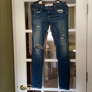 Distressed, Very cute. These are not a typical size six but 2-4. Zero stretch